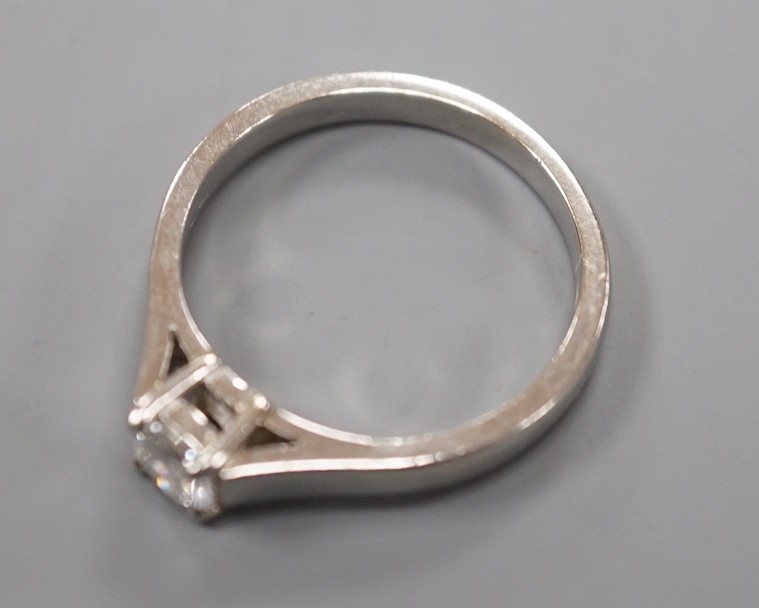 A modern platinum and solitaire diamond ring, size M, gross weight 5.2 grams